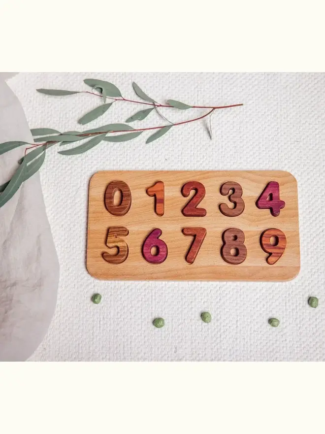 Wooden Number Puzzle Heirloom Toy, on a table. 