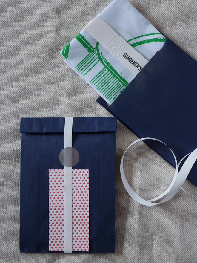 Optional Gift wrap Gardener Hankie, navy paper with white ribbon