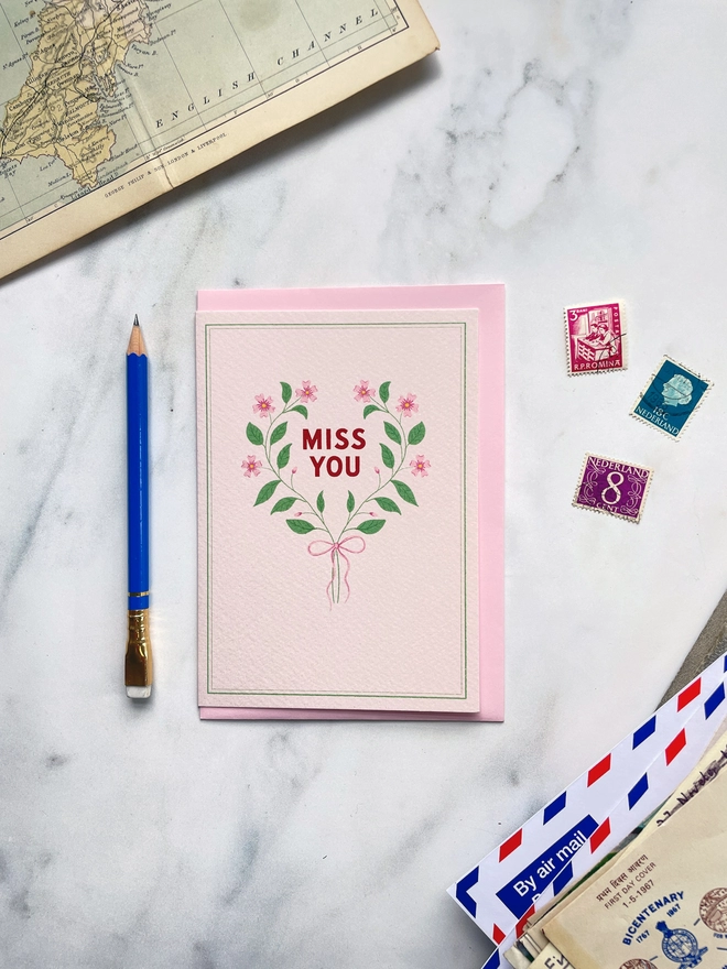 greeting card flat lay miss you postage stamps