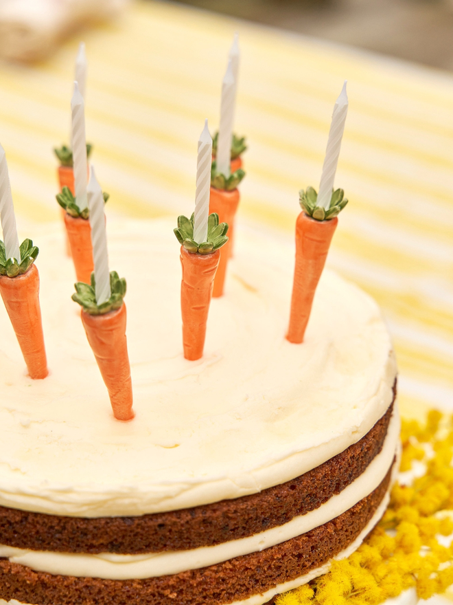 Carrot candle holders on an Easter cake