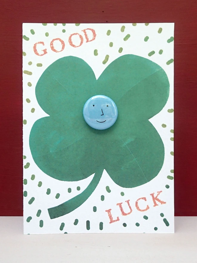 lucky clover good luck card with face pin badge