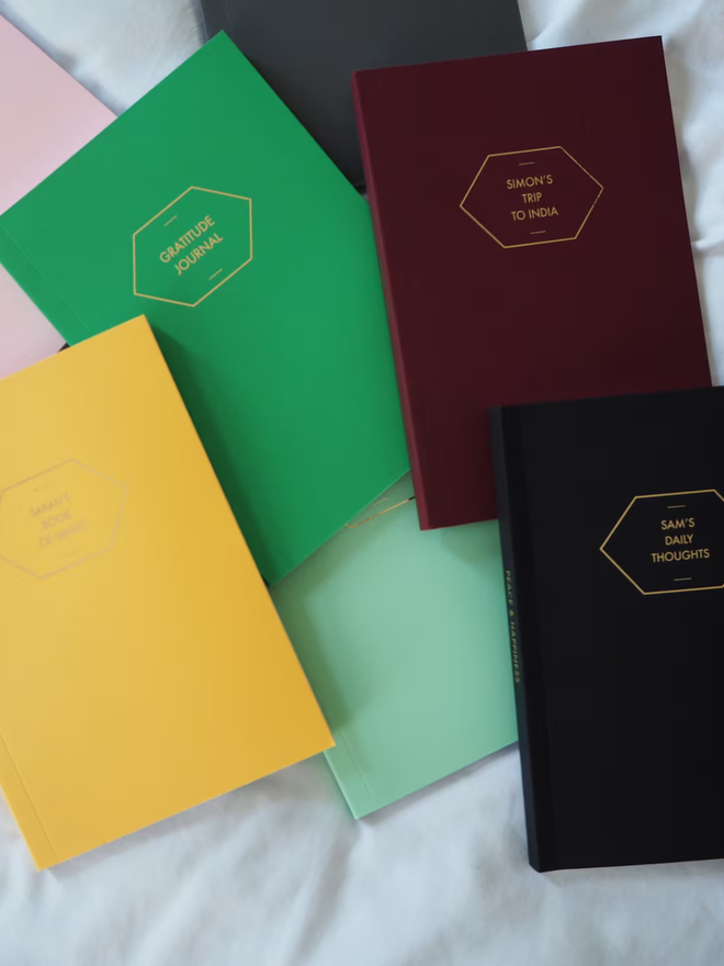 personalised gold foil a5 notebook. coloured notebooks with gold personalisation.