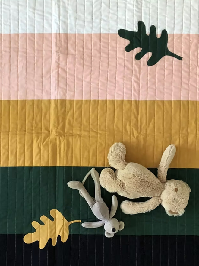 Autumn Leaf Stripe Cotton Baby Quilt. A multicoloured autumnal quilt.
