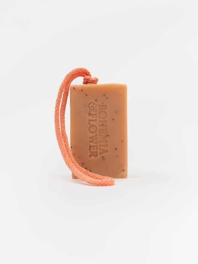 Garden Soap on a Rope - handmade pink clay shower soap with lavender and palma rosa, gentle poppy seed exfoliation, and a colourful British-made cotton rope. A beautiful, eco-friendly gift for gardeners and flower lovers