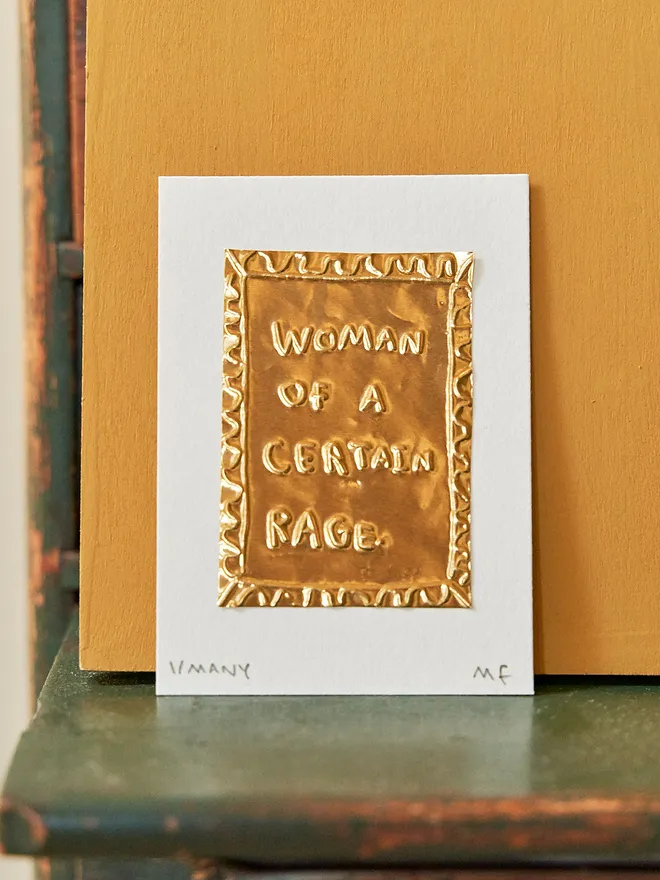 'Woman Of A Certain Rage' Gold Tin Embossing