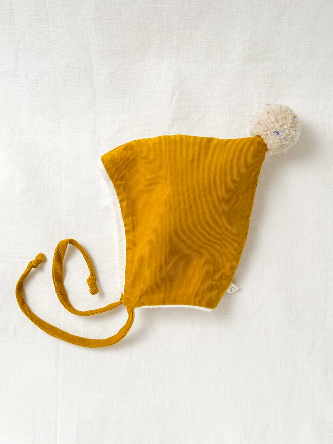 Mustard corduroy baby pixie hat with wool pom pom