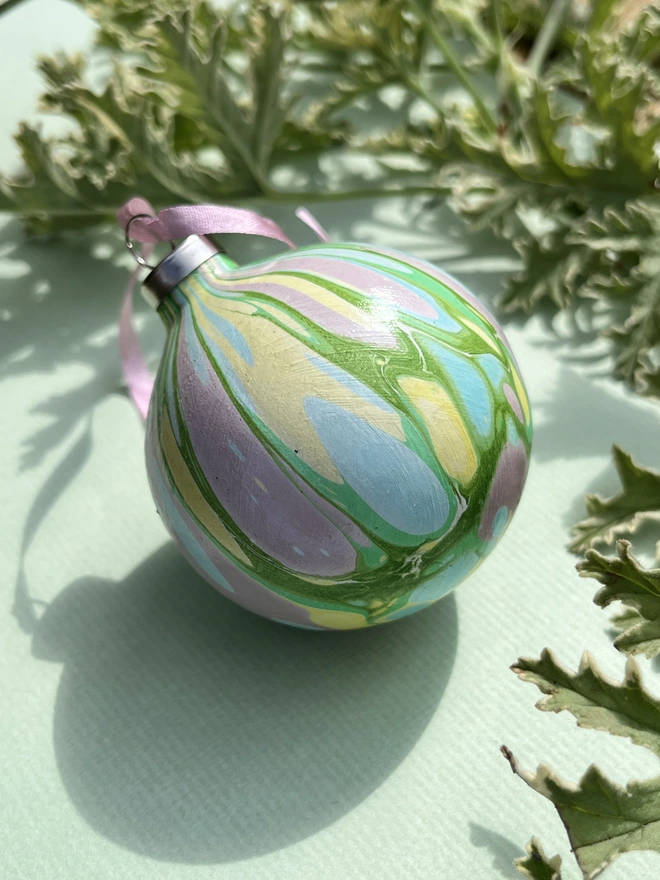 Hand-marbled round ceramic Christmas bauble