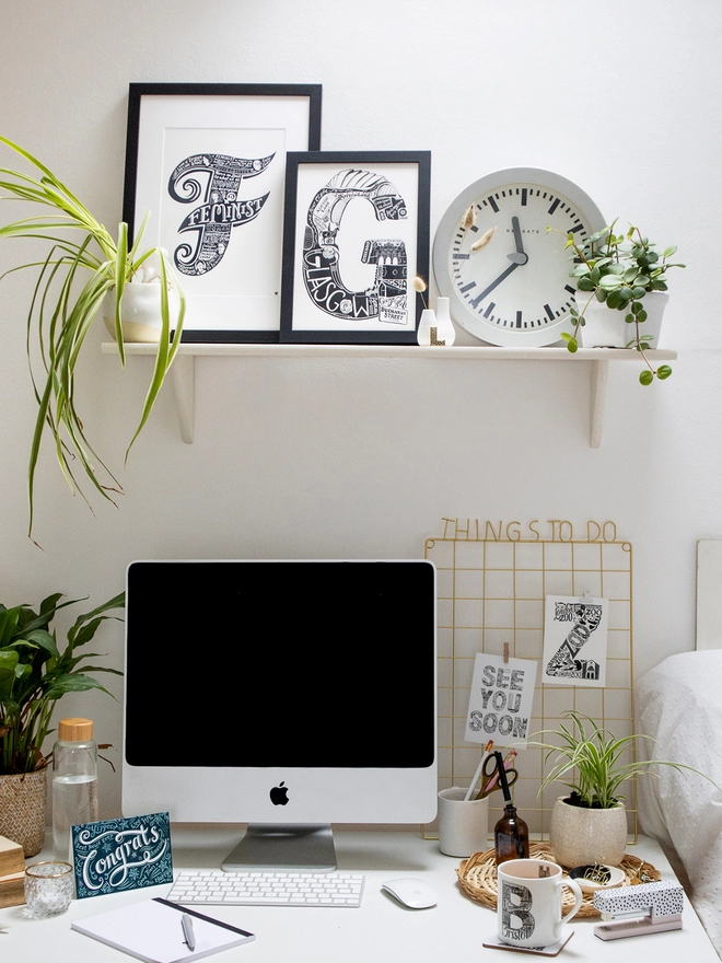 Home office styling with monochrome typographic prints