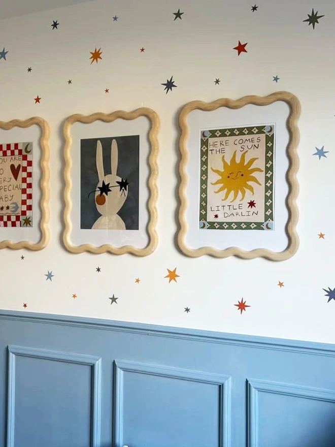 Ducks In A Row Warm Winter Star Wall Stickers in boys bedroom with curvy picture frames and illustrations