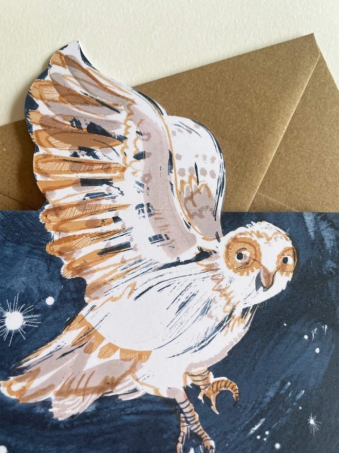 Esther Kent Night Owl illustrated greetings card shows a painterly white and brown owl on a dark blue sky. The wing folds out.