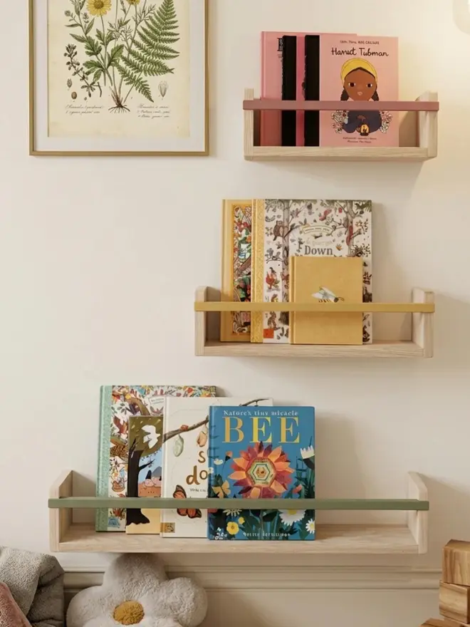 The Story Shelf - A book shelf with beautiful colour bracket placed in a childs bedroom 