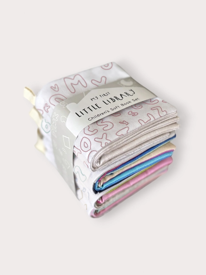 Flat lay of the 4 soft books included
