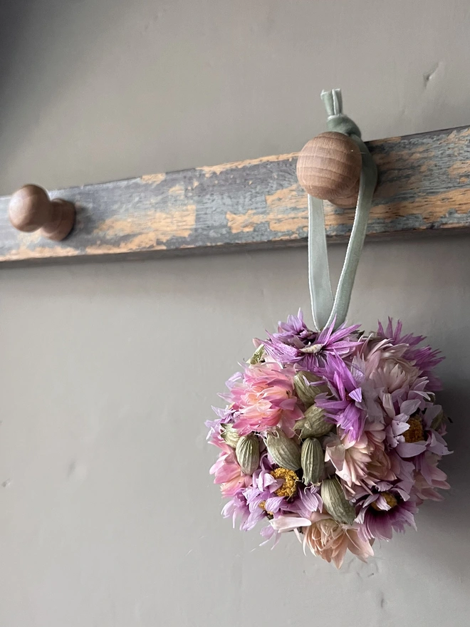 Pink and Green Dried Flower Bauble. A bauble made of dried seasonal flowers.