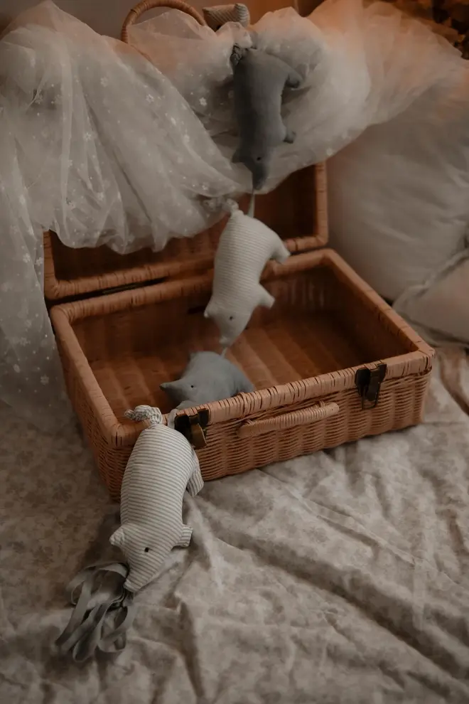 Pig Garland Decoration, a grey and white pig garland decoration in a child's bedroom. It is accompanied by other bedroom accessories. 