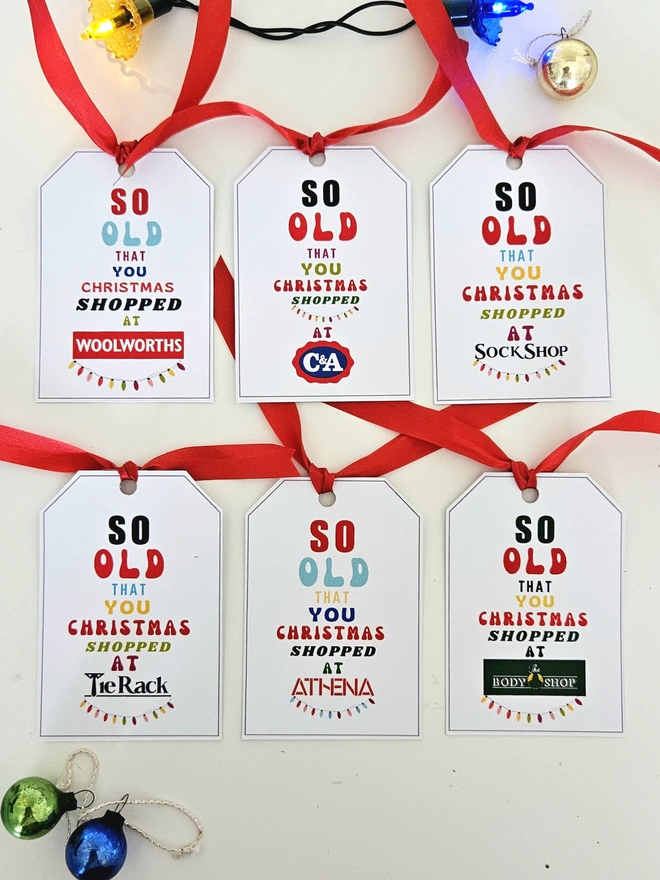 A choice of 6 gift tags that say so old that you Christmas shopped at Woolworths, C&A, Athena, Tie Rack, Sock Shop to match the paper.
