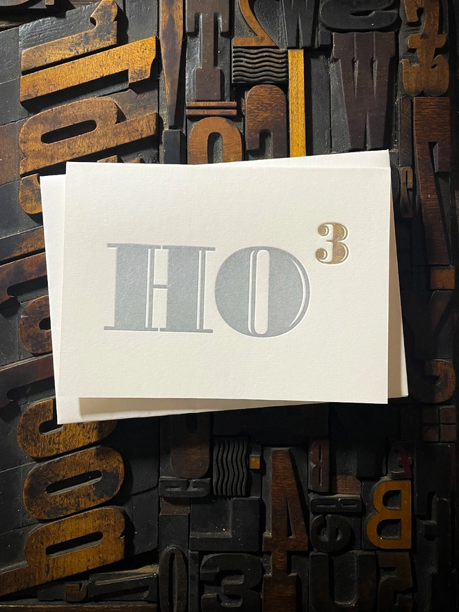 Ho Ho Ho! A beautiful typographic letterpress Christmas card. Printed in rich metallic silver and gold inks with luxury matching and contrasting envelopes; ideal to send to your designer friends at the festive season.