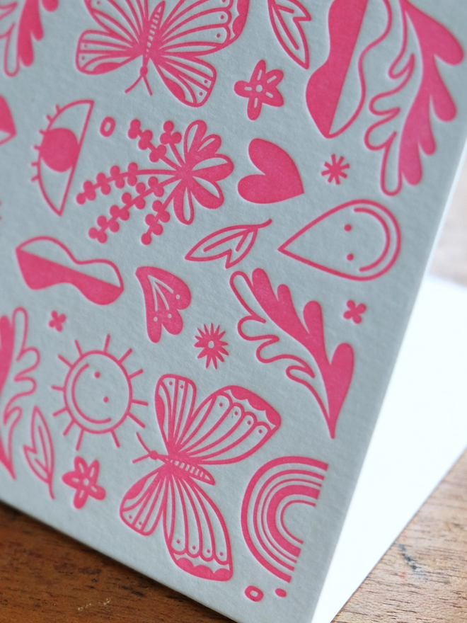 Pink fun letterpress printed shapes on white wild card. 