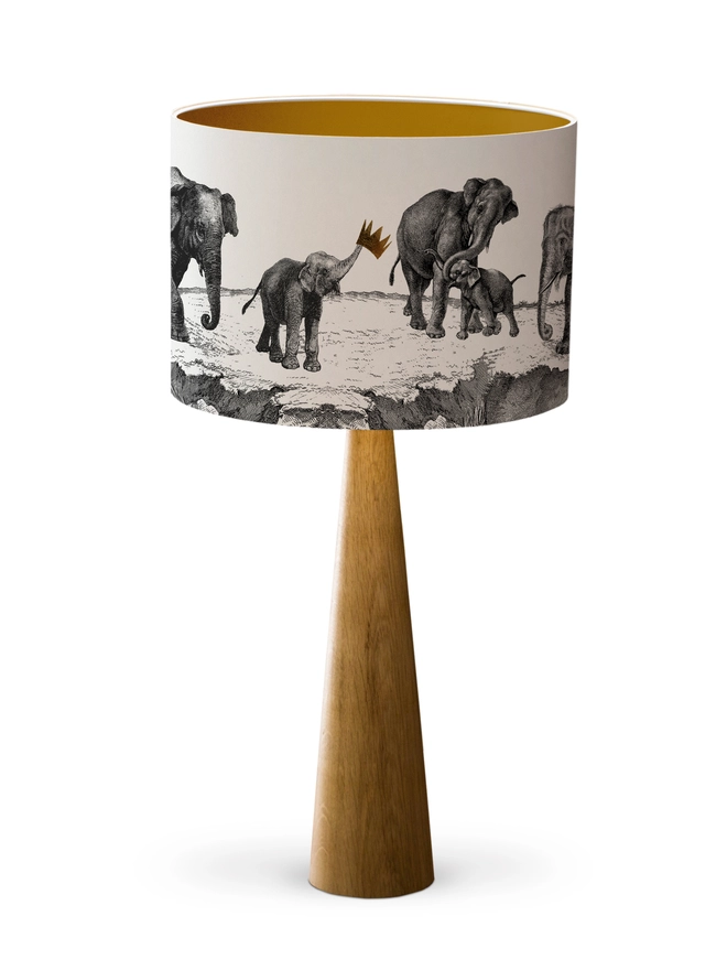 Handmade lampshade featuring adorable mischievous baby elephants playing together, inspired by Whipsnade Zoo, with a playful animal design.