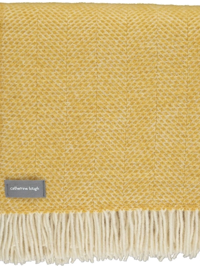 Organic Wool Throw, an organic wool throw folded on a white surface. 