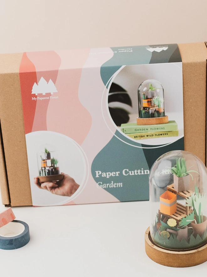 a box and packaging of my papercut forest garden craft kit