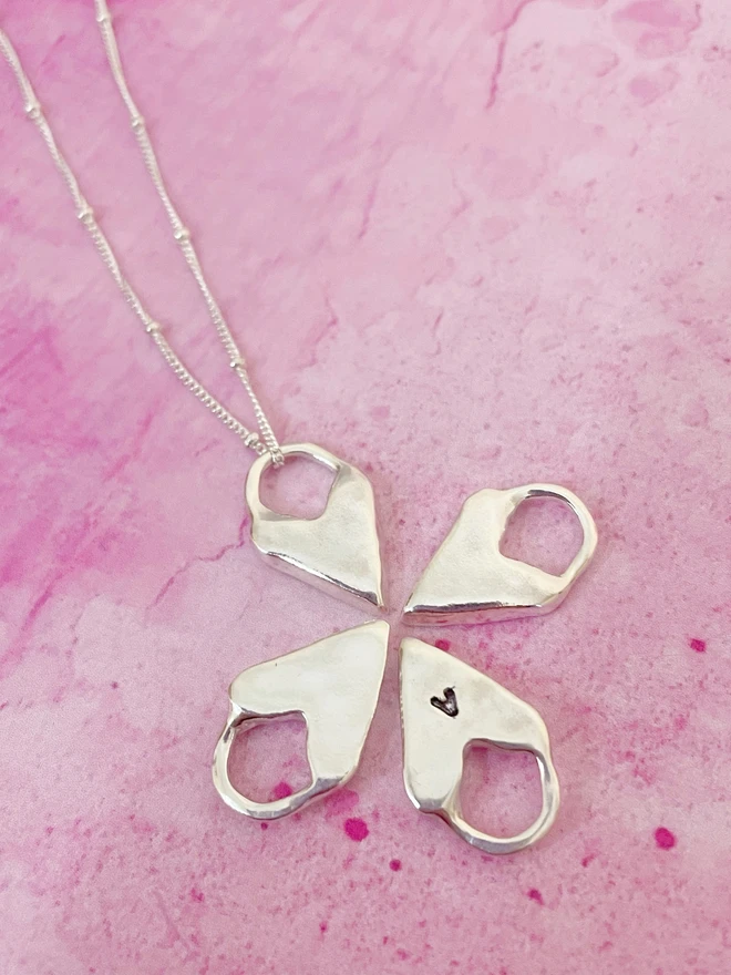 Hand made heart talisman charms made from 100% recycled sterling silver, cute gift for girlfriend or wife for Valentine's Day or Mother's Day. Send straight to your special someone. Made by Celina C Jewellery, a small business in the UK, find on Holly and Co.