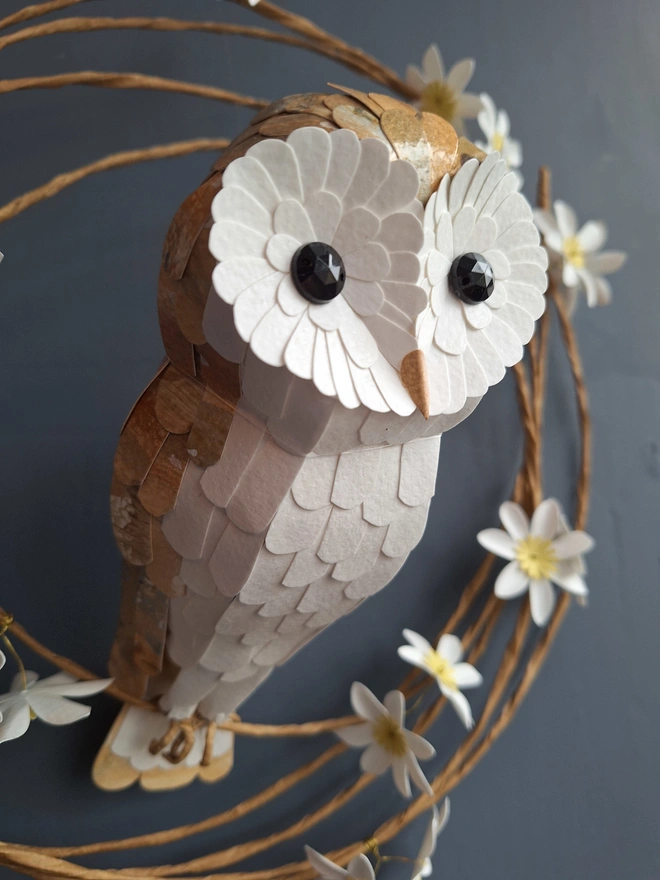 Kaper barn owl on a floral wreath wall sculpture close up