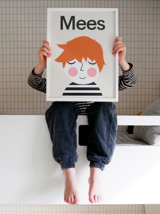 boy holding his personalised portrait