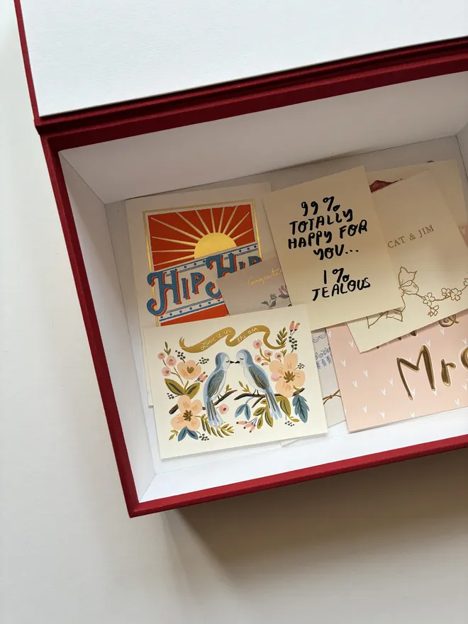 Detail of an open handmade wedding postbox by Keep Collect with card contents
