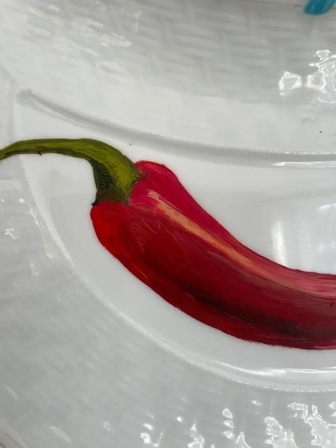 Zoom-in on Fine Art Oil Painted Chilli On A antique Side Plate.
