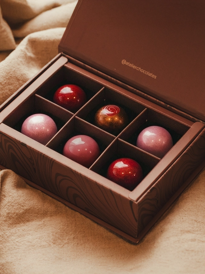 An Atelier Chocolates Valentine's collection of six artisan bon bons.