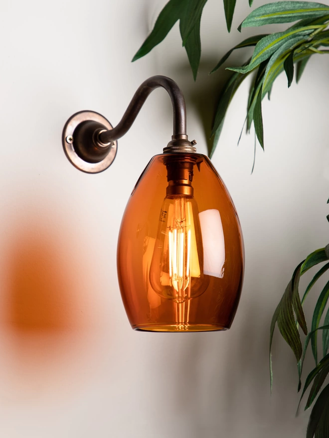 Amber Wall Light Shown In Small With Old English Bracket