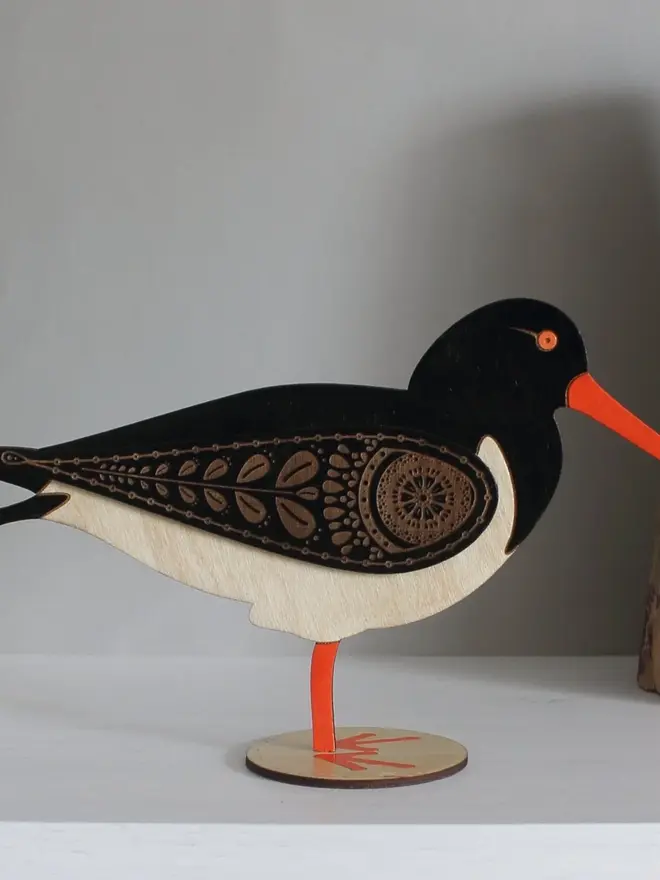 Standing Wooden Oyster Catcher, wooden bird decoration standing on a platform. 