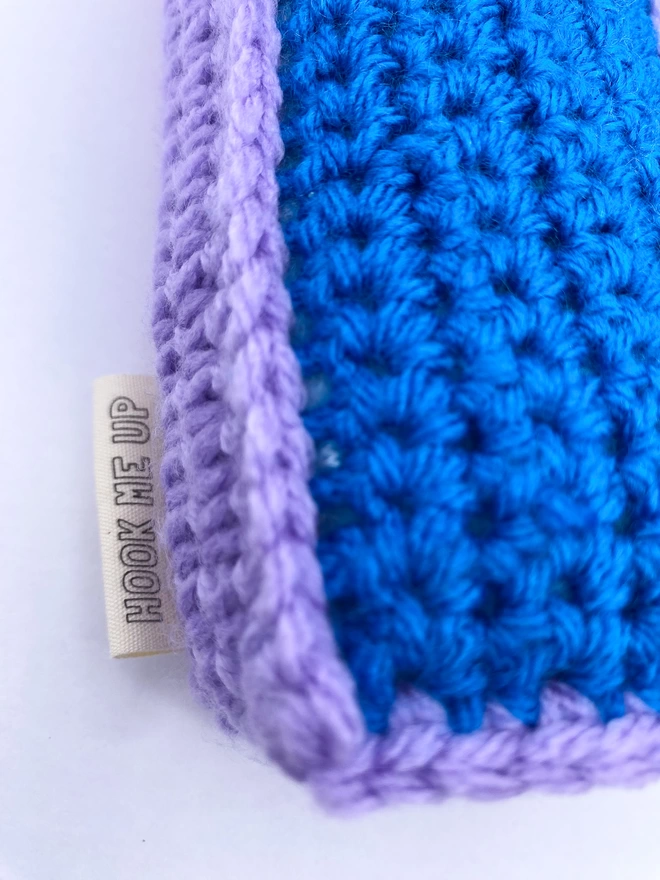 Crocheted Letter K in Blue and Lilac, close up of label