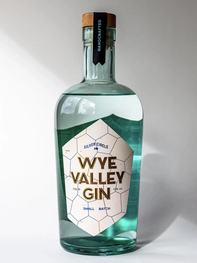  Wye Valley Gin, bottle of spirit on a white surface. 