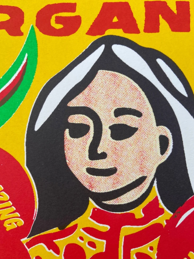 Amazing Organic Print. A closeup of the face of the person holding the organic fruit featured in the print.