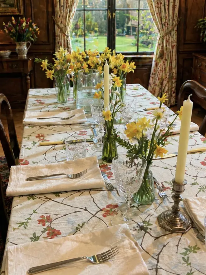Winter floral tablecloth covered in scarlet red Qunice flowers