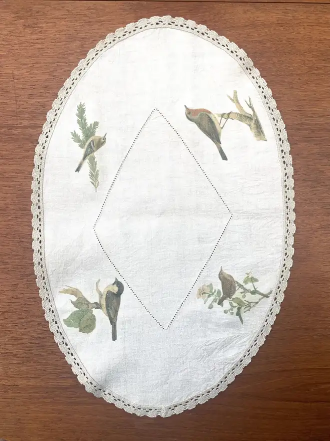 oval centrepiece tablecloth printed with garden birds