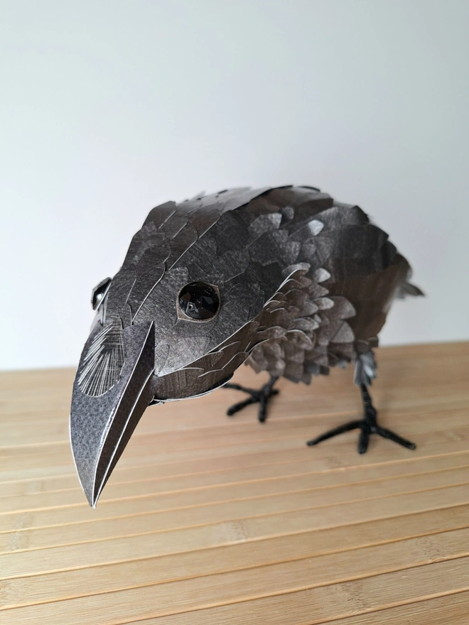 face close up of a raven sculpture
