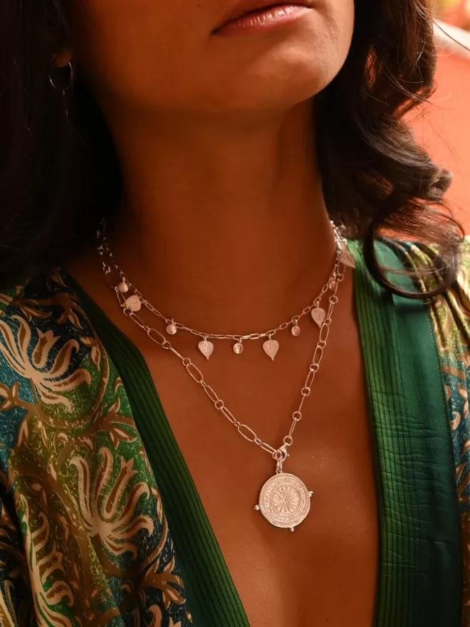 Baby Tree of Life choker layered with large silver coin necklace worn with green kimono by Loft & Daughter