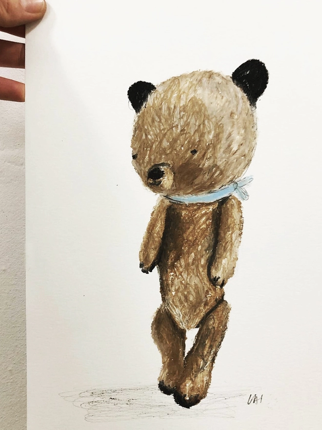 signed drawing of pale brown bear with blue necktie 