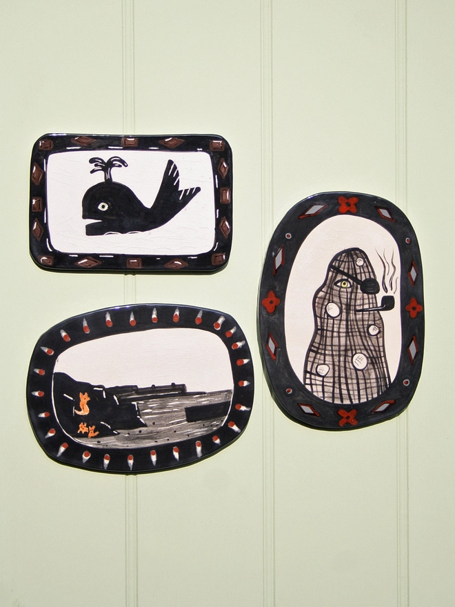 ceramic wall art decorative seaside silhouette of foxy rocks, Captain Netty and Whale  