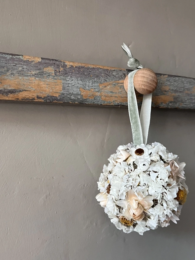Snow Dried Flower Bauble. A dried flower bauble made of seasonal white flowers.