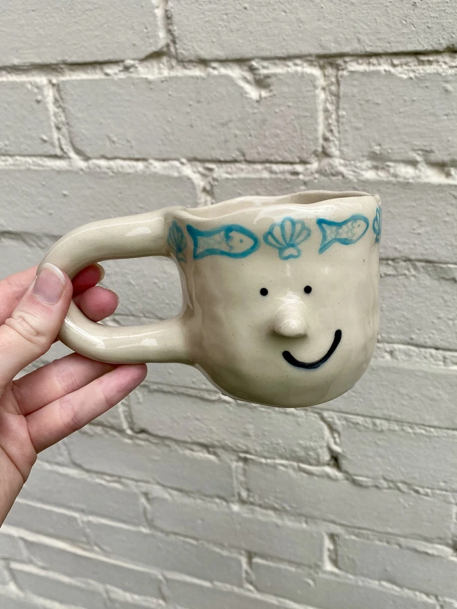 fish and shell mug