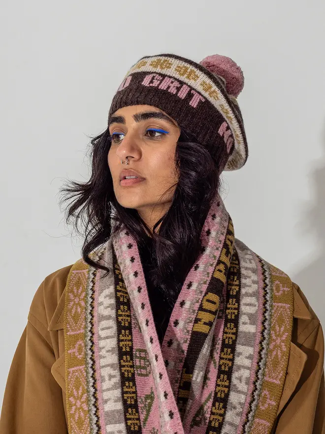 Model is wearing the fairisle loop scarf and tam in cocoa 