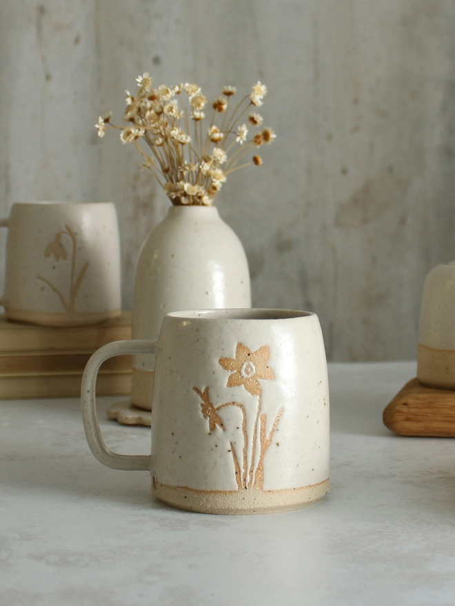 Narcissus white mug on table setting