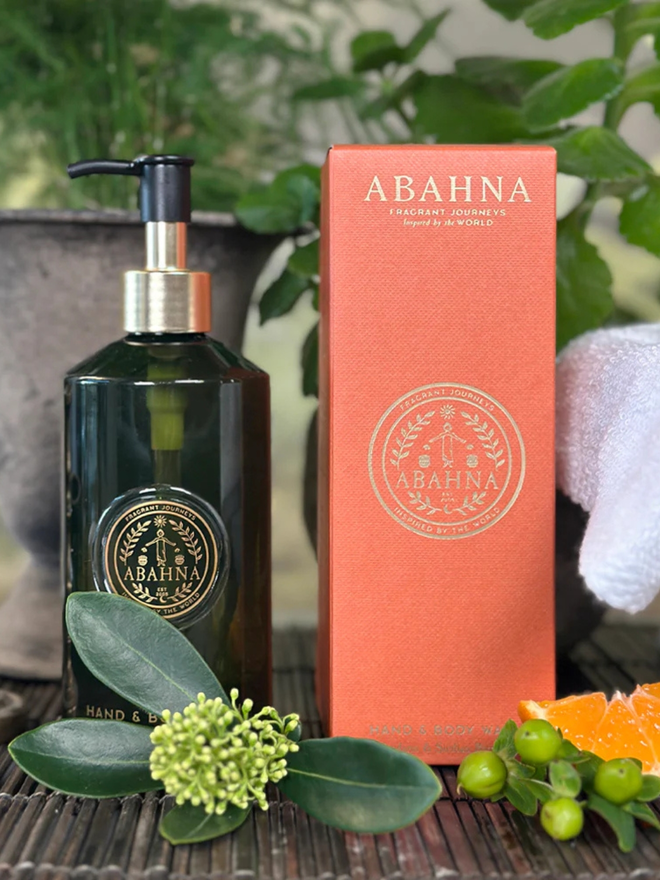 mandarin and sicilian bergamot hand and body wash. a green pump bottle and orange box containing natural hand and body wash.