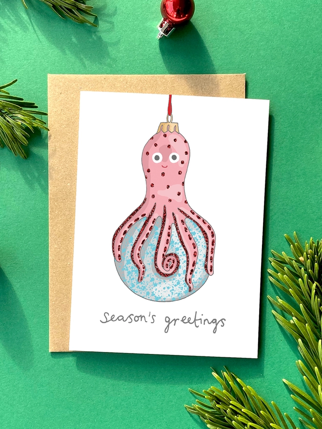 Festive Christmas card featuring kitsch octopus decoration