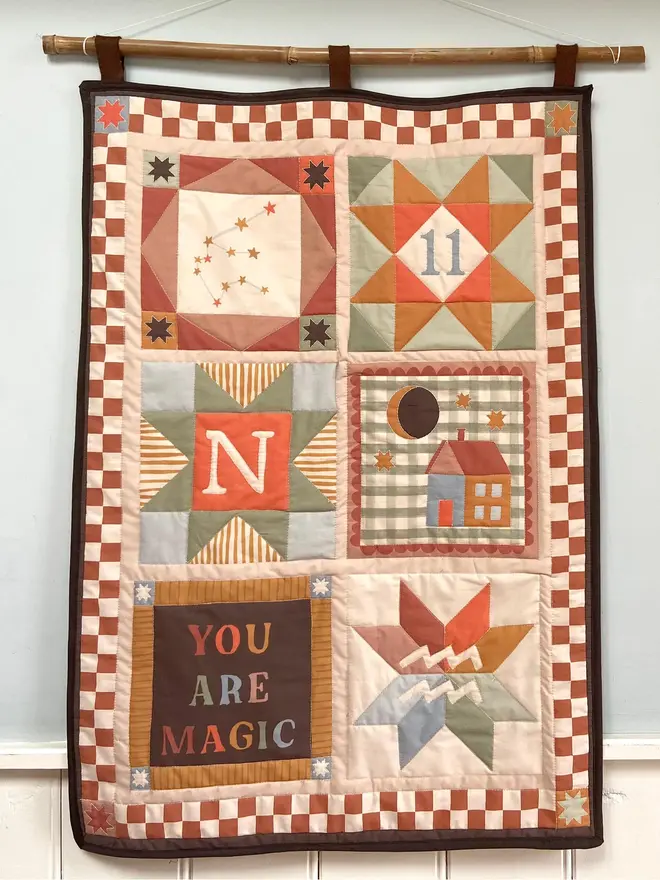 personalised baby quilted wall hanging. a patchwork hanging quilt decoration to commemorate a baby's birth.