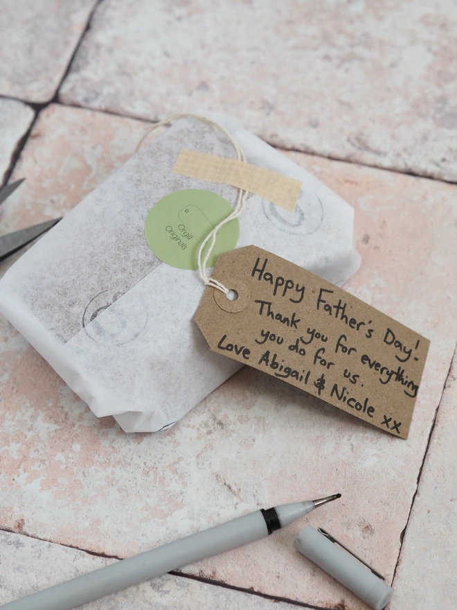 Personalised leather gift. Wrapped in tissue paper with a hand written gift tag message.
