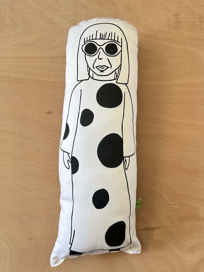 Illustrated cushion featuring the Japanese artist Yayoi Kusama